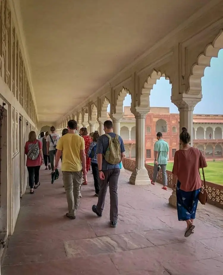 The group walking a long arcaded corridor at Agra Fort