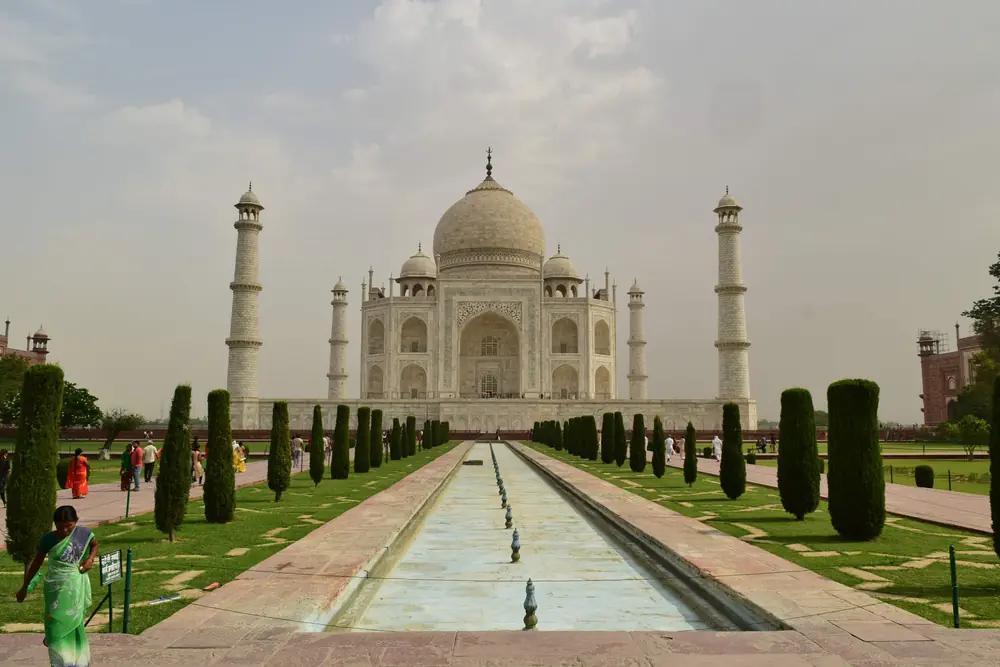 The Taj Mahal at the end of its reflecting pool in the early morning